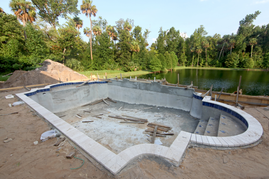 Partially built pool by California Custom Pools by lake