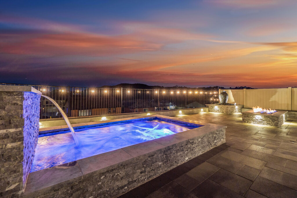 Rooftop spa with fire pit and sunset view