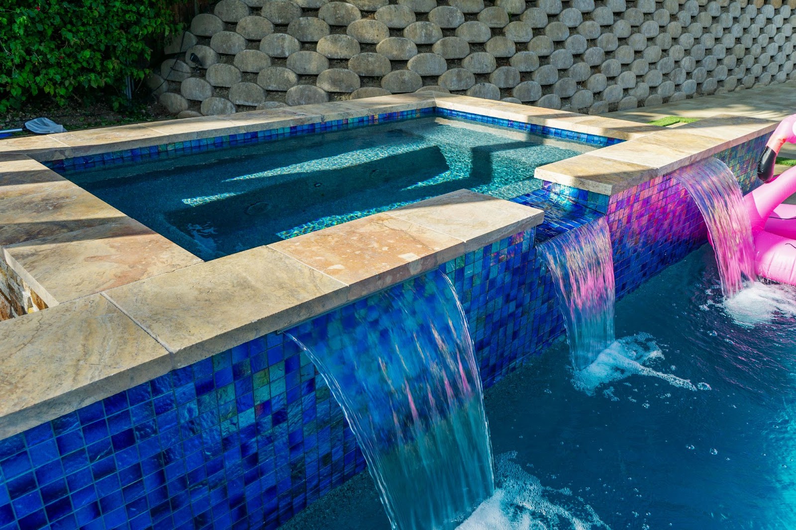 Luxury California custom pool with water feature and fire pit