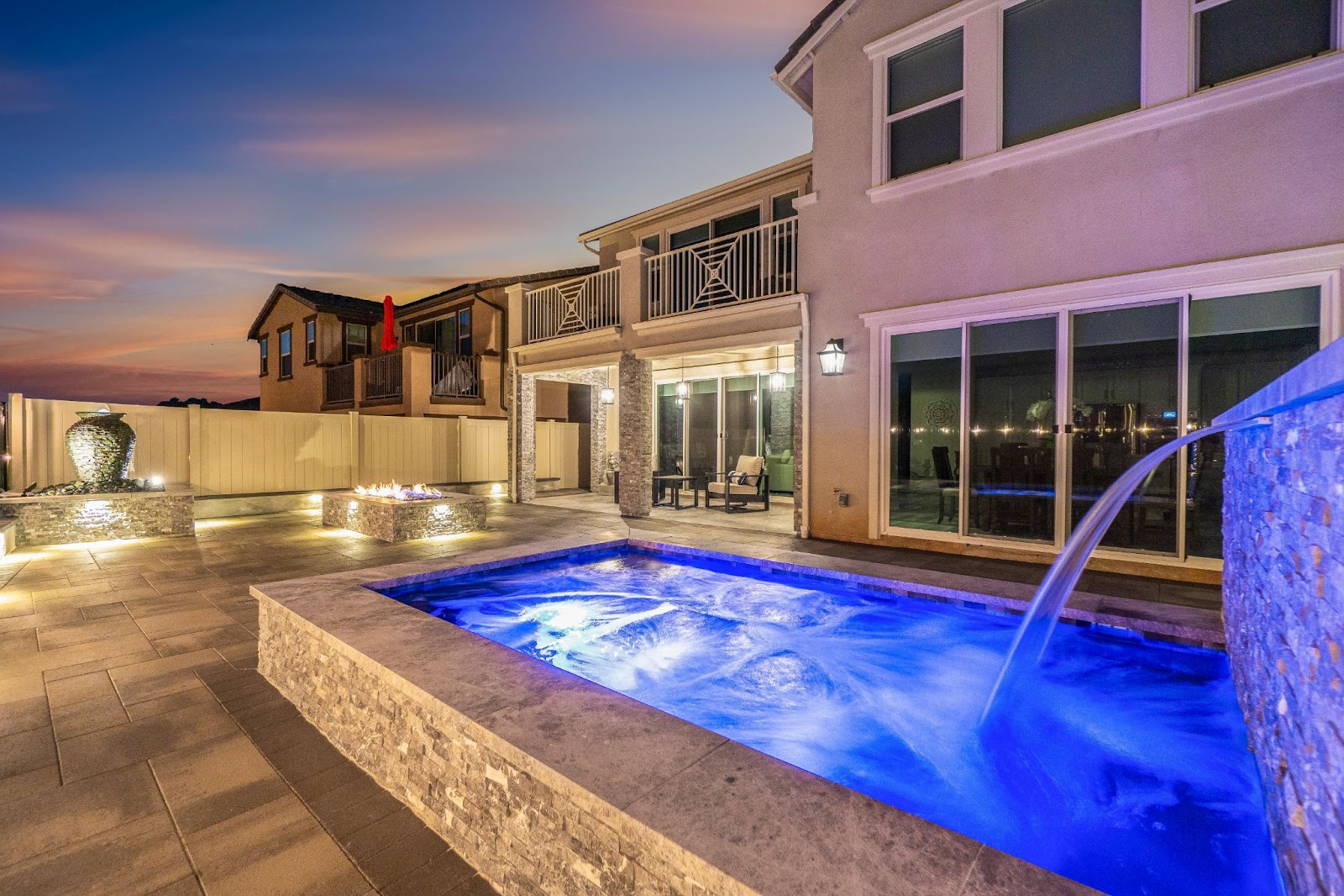 Modern California custom pool with LED lights and water feature