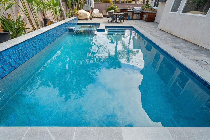 Modern backyard pool by California Custom Pools